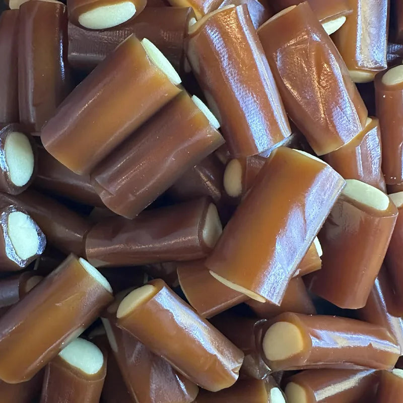Close-up of a pile of caramel candies with vanilla cream center