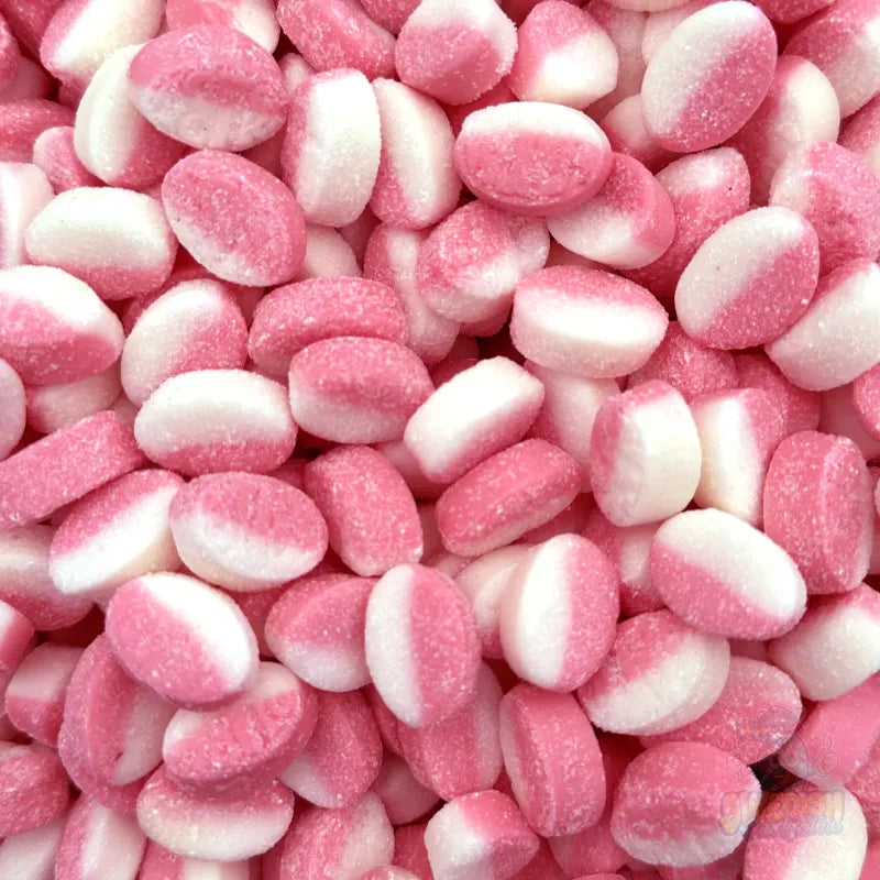 Close-up of pink and white Bubs Strawberry/Vanilla Micro Ovals