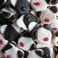 Close-up of panda-shaped candies with black and white colors.